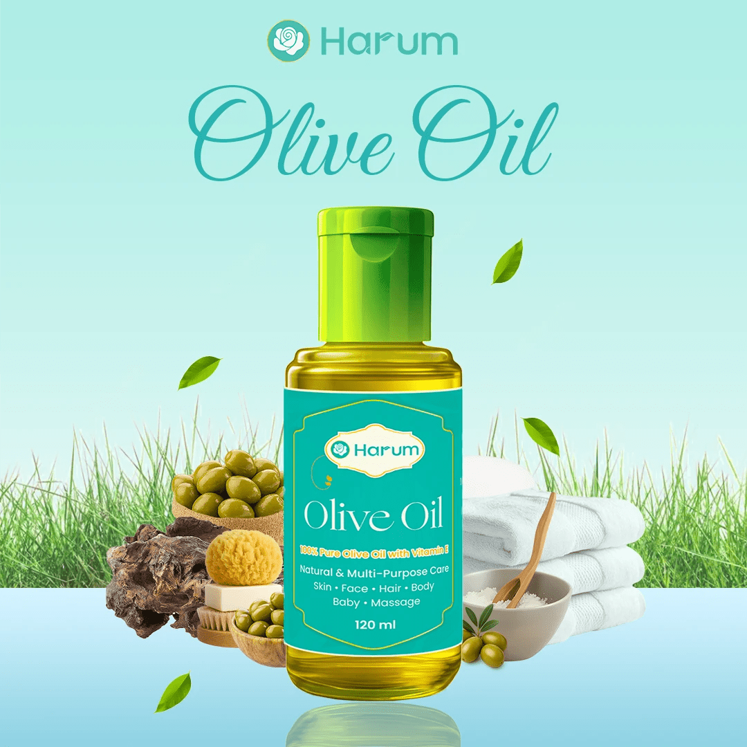 Harum Olive Oil bottle with Vitamin E placed beside natural ingredients and towels, showcasing premium multi-purpose skincare oil for face, hair, body, and baby massage.