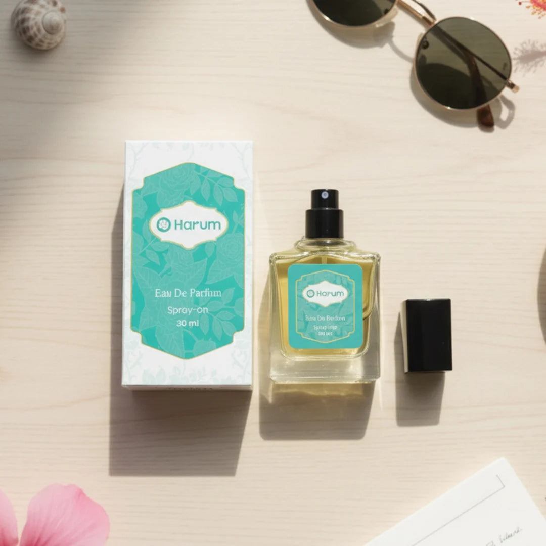 Harum.sg Eau De Parfum 30ml perfume bottle and box on wooden background with sunlight and summer accessories