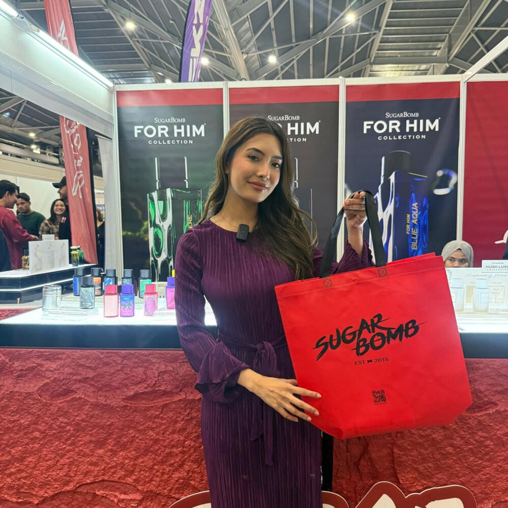 A promotional model showcasing the best perfume store products from SugarBomb SG's long-lasting fragrance line in Singapore.