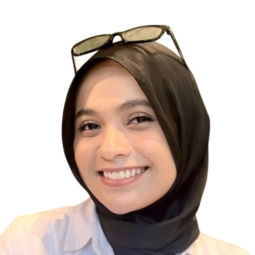 Woman wearing a hijab with sunglasses on her head against a white background