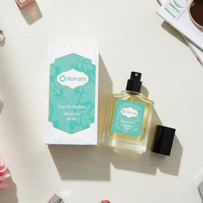 Harum Eau De Parfum 30ml perfume bottle with teal box on white table flat lay