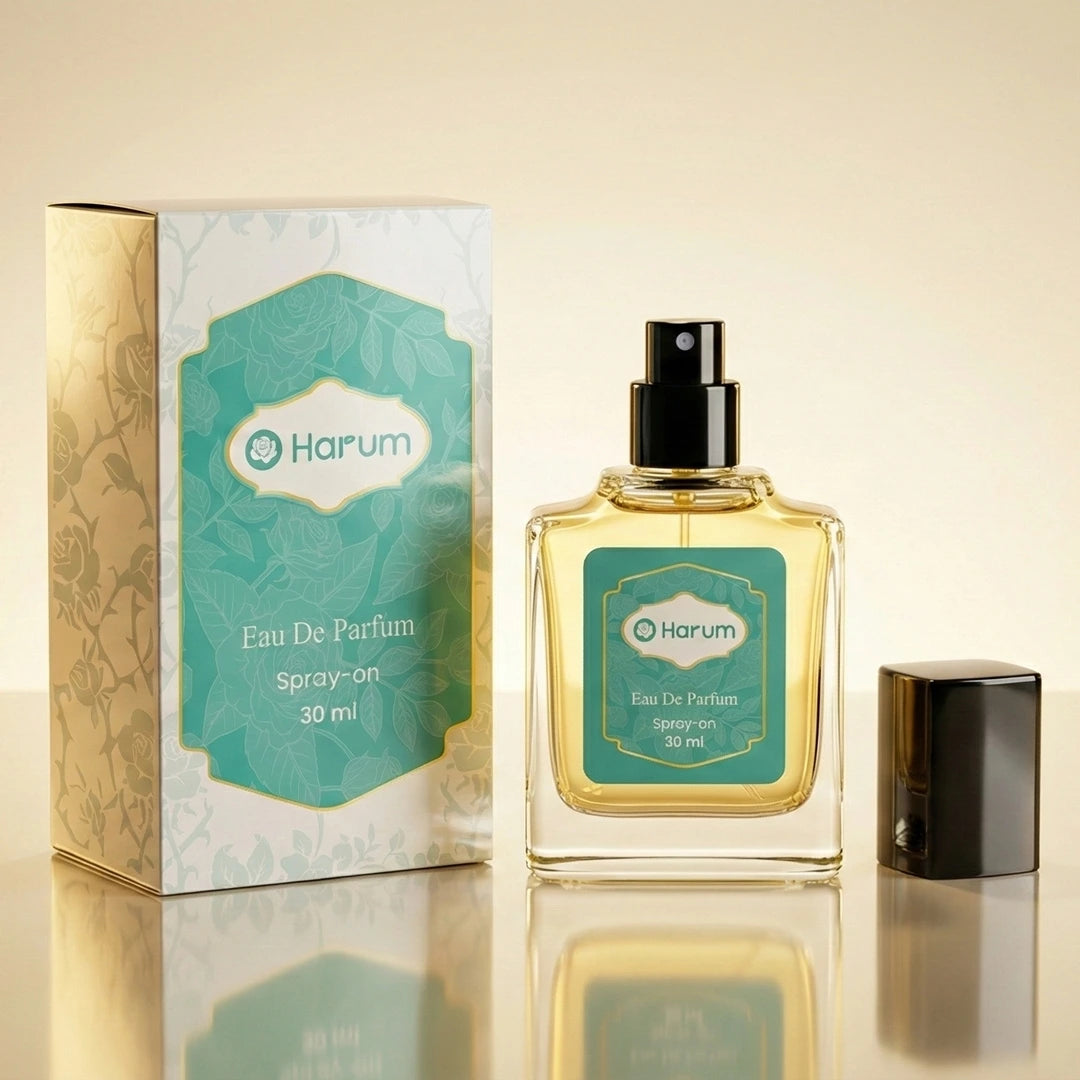 Harum 30ml Eau de Parfum bottle with teal label and box displayed on satin fabric in a luxury flatlay with gold accessories and roses.