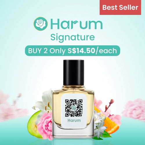 Harum Signature perfume bottle with floral elements on a light blue background