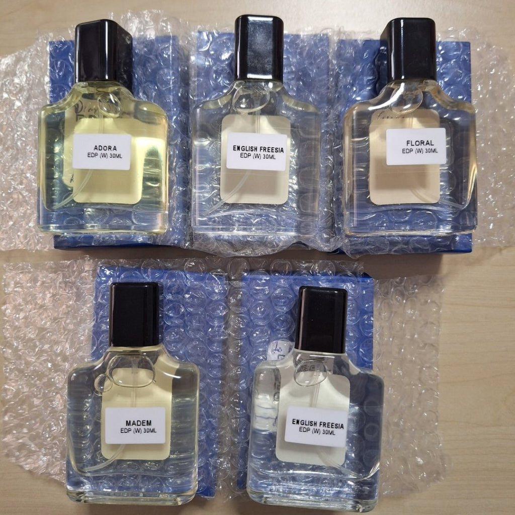 Happy customer Norseha Mohd Din showing her collection of 5 Harum SG perfume bottles which just arrived.