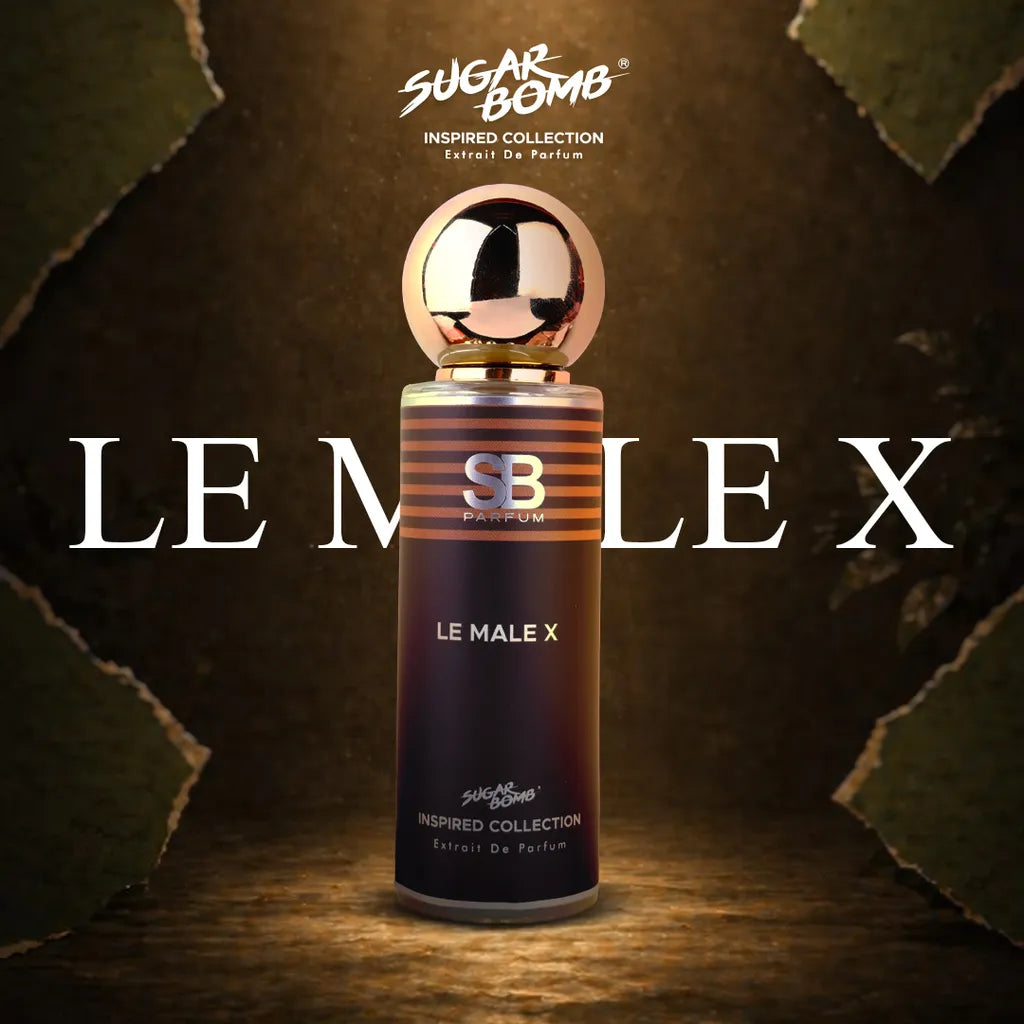 SugarBomb Le Male X Extrait De Parfum bottle from the Inspired Collection, a clone fragrance inspired by Jean Paul Gaultier Le Male Elixir. The product shot shows the dark brown striped perfume bottle with a round gold metallic cap centered in a spotlight against a dark textured background.