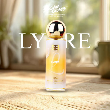 SugarBomb Lybre Extrait De Parfum from the Inspired Collection, a floral lavender fragrance inspired by YSL Libre, standing on a bright wooden table with soft indoor lighting.