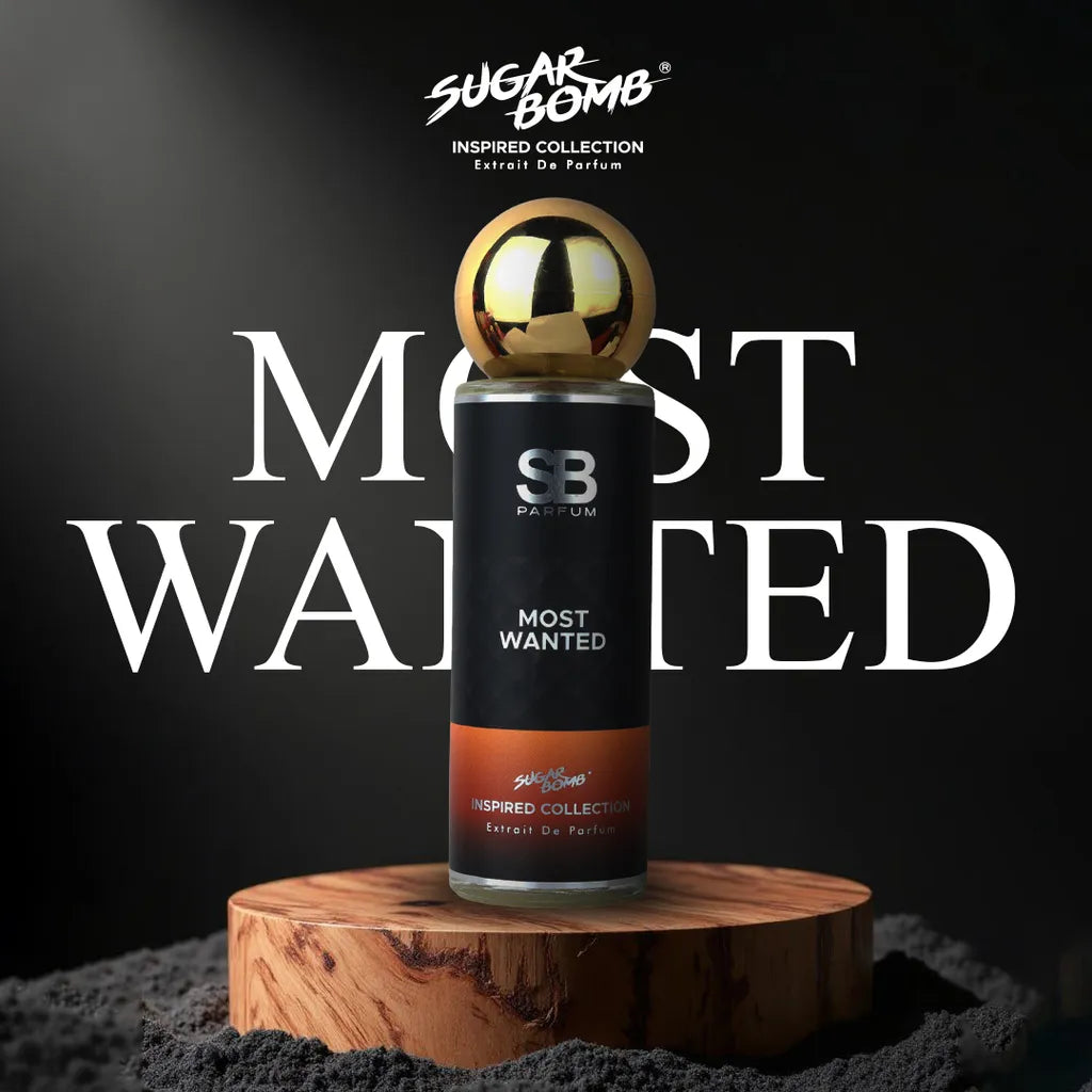SugarBomb Most Wanted Extrait De Parfum from the Inspired Collection, a spicy amber men's fragrance inspired by Azzaro The Most Wanted, set on a natural wood block with a dark spotlight background.