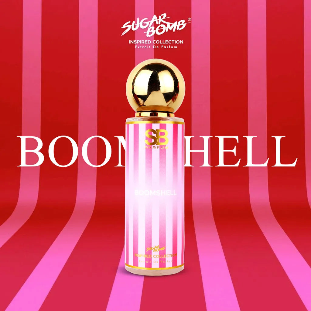 SugarBomb Boomshell Extrait De Parfum bottle from the Inspired Collection, centered against a vibrant pink and red vertical candy-striped backdrop.