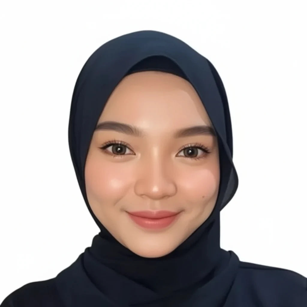 Syahira, a team member at Harum SG, wearing a dark navy hijab against a white background.